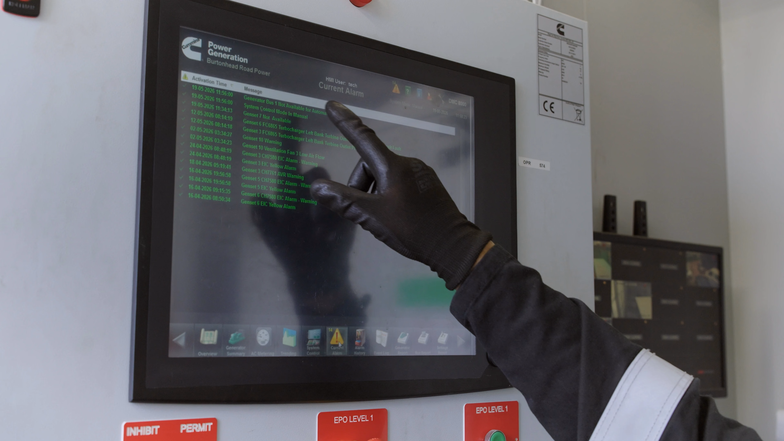 YLEM engineer checking a Cummins generator control screen at Terra Firma