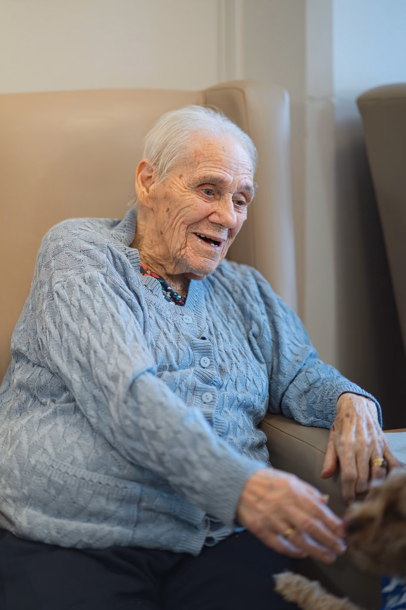 A resident laughing during a conversation