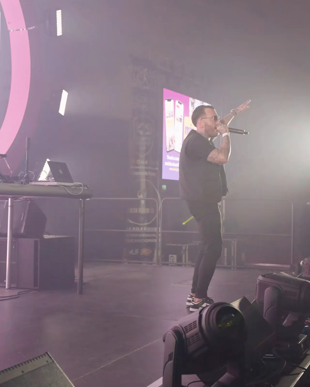 Artist on stage under white light before the set