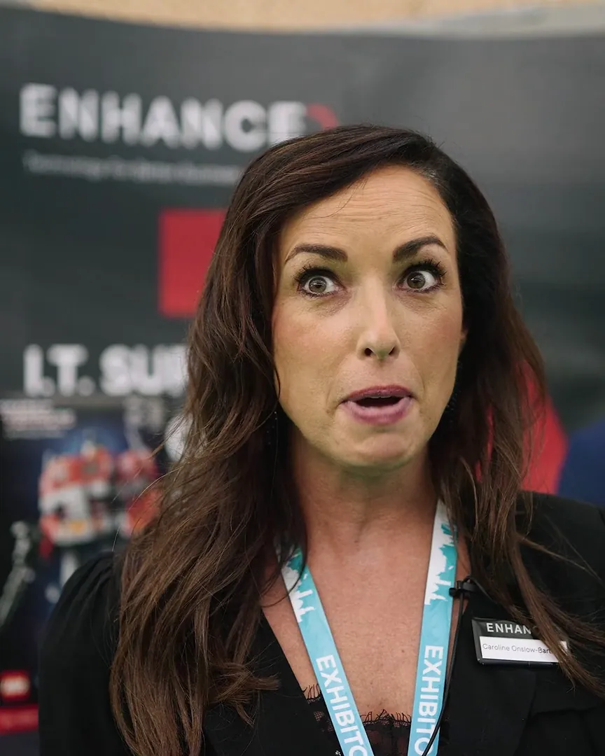 Exhibitor interviewed on a busy show floor