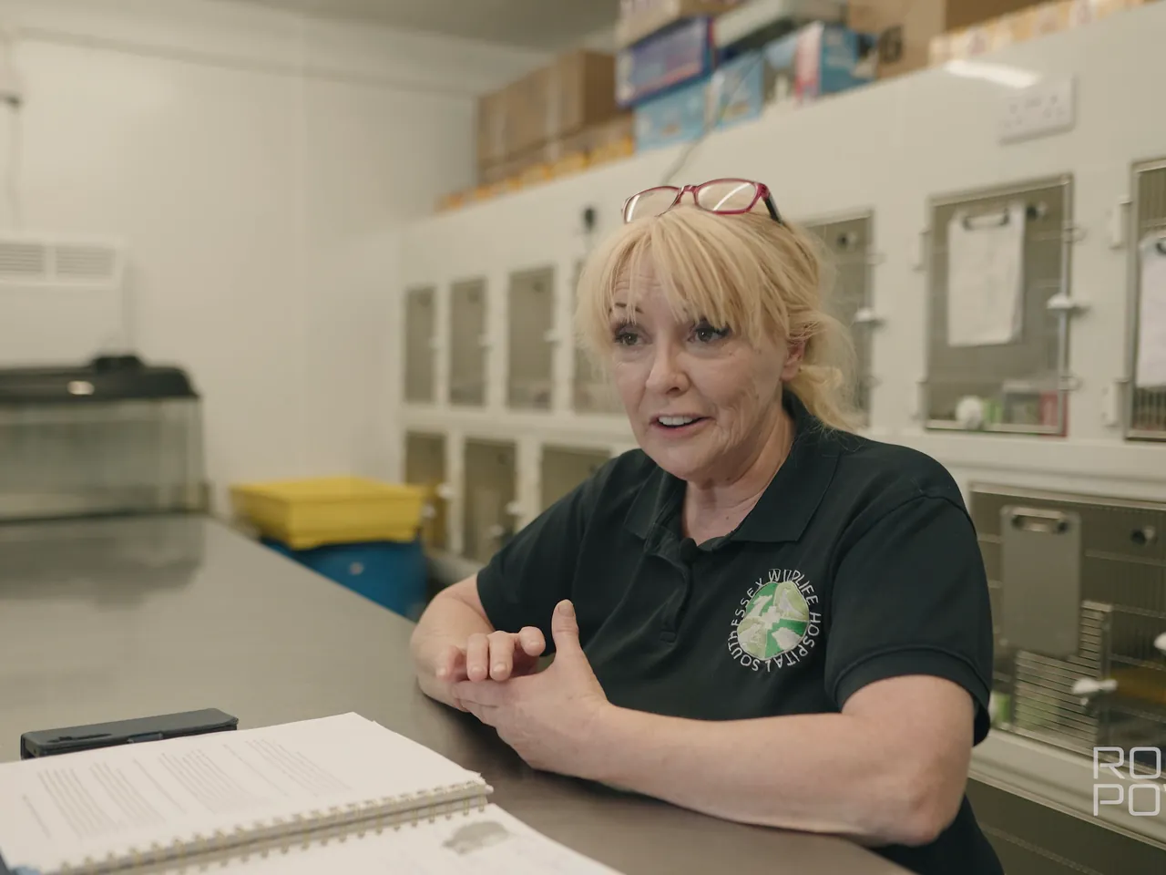Hospital staff member interviewed at a desk