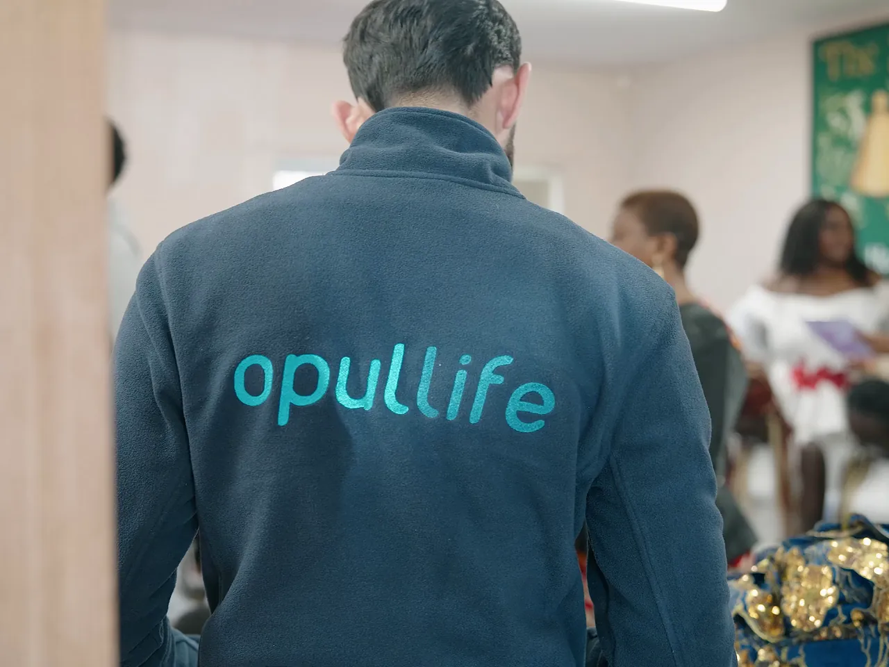 Opul Life team member at a community event