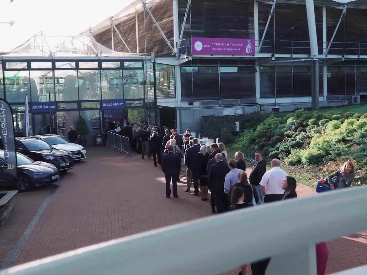 Guests queueing outside the venue as an event opens