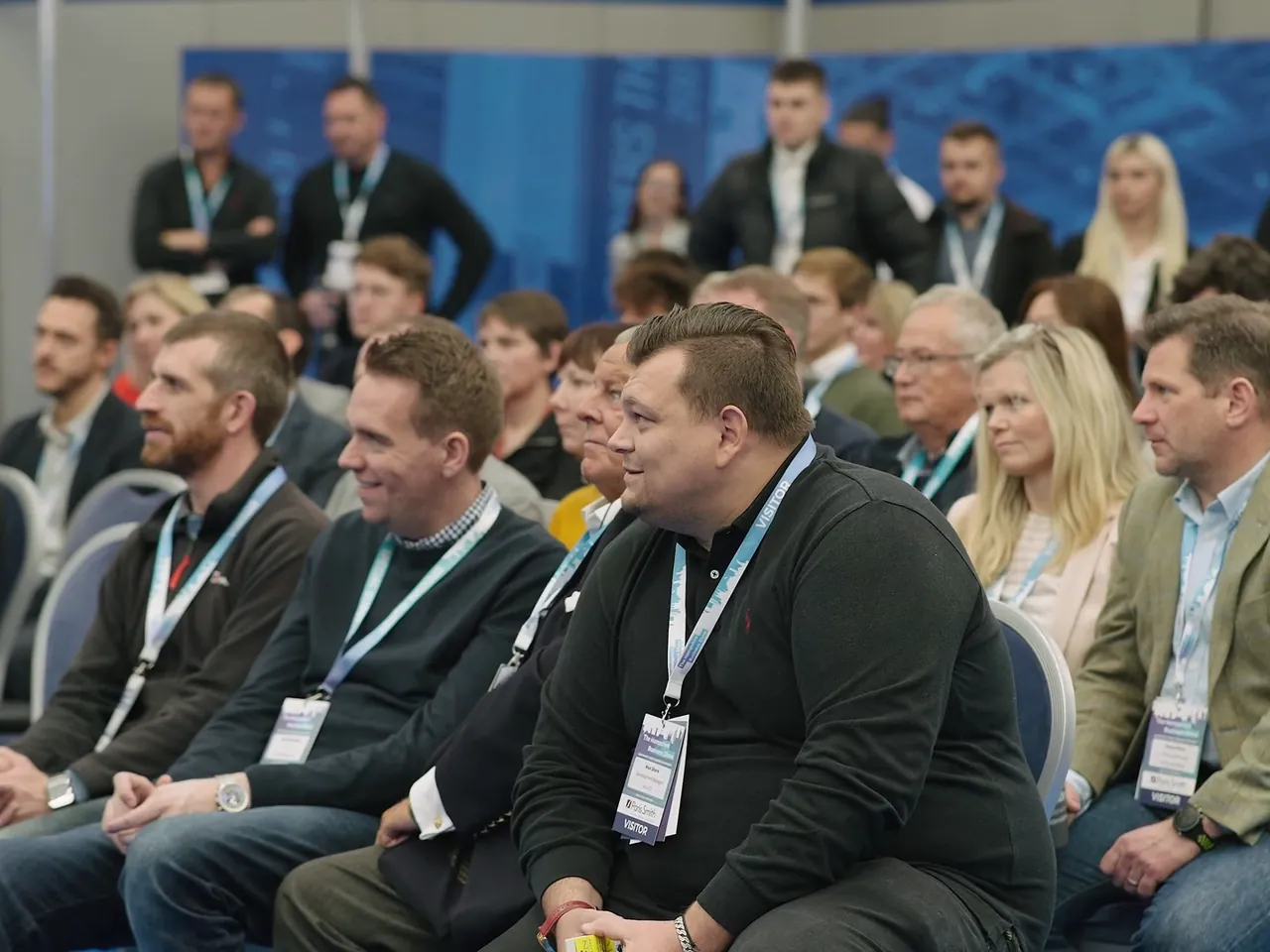 Seated audience listening during a business show session
