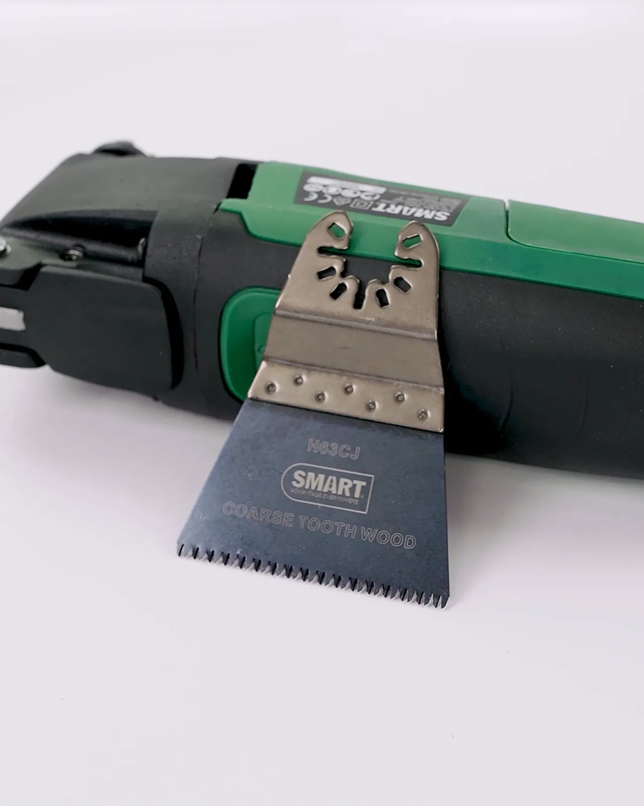 Multi-tool with a saw blade on white