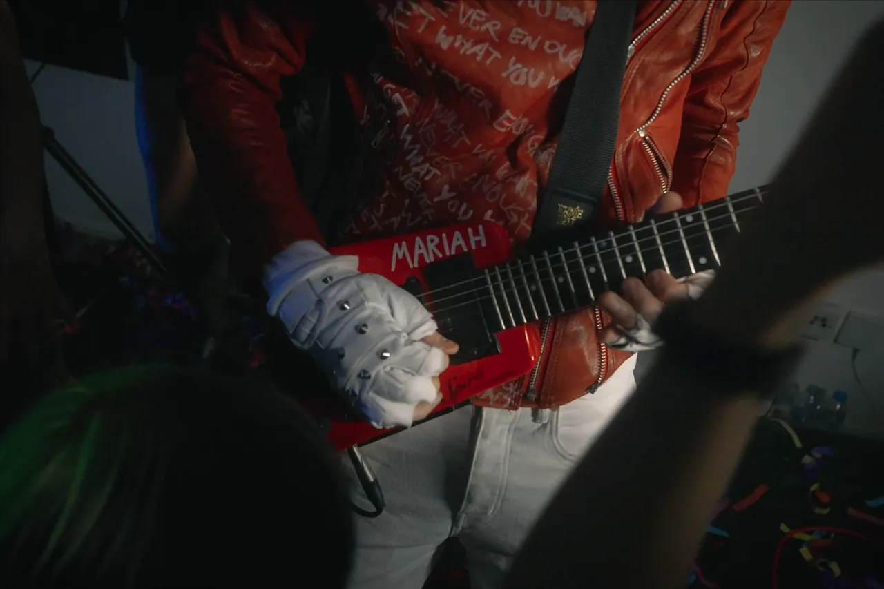Close-up of the red guitar
