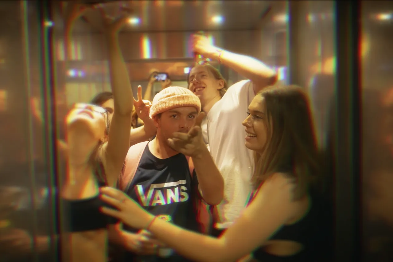 Guests framed through a glass door