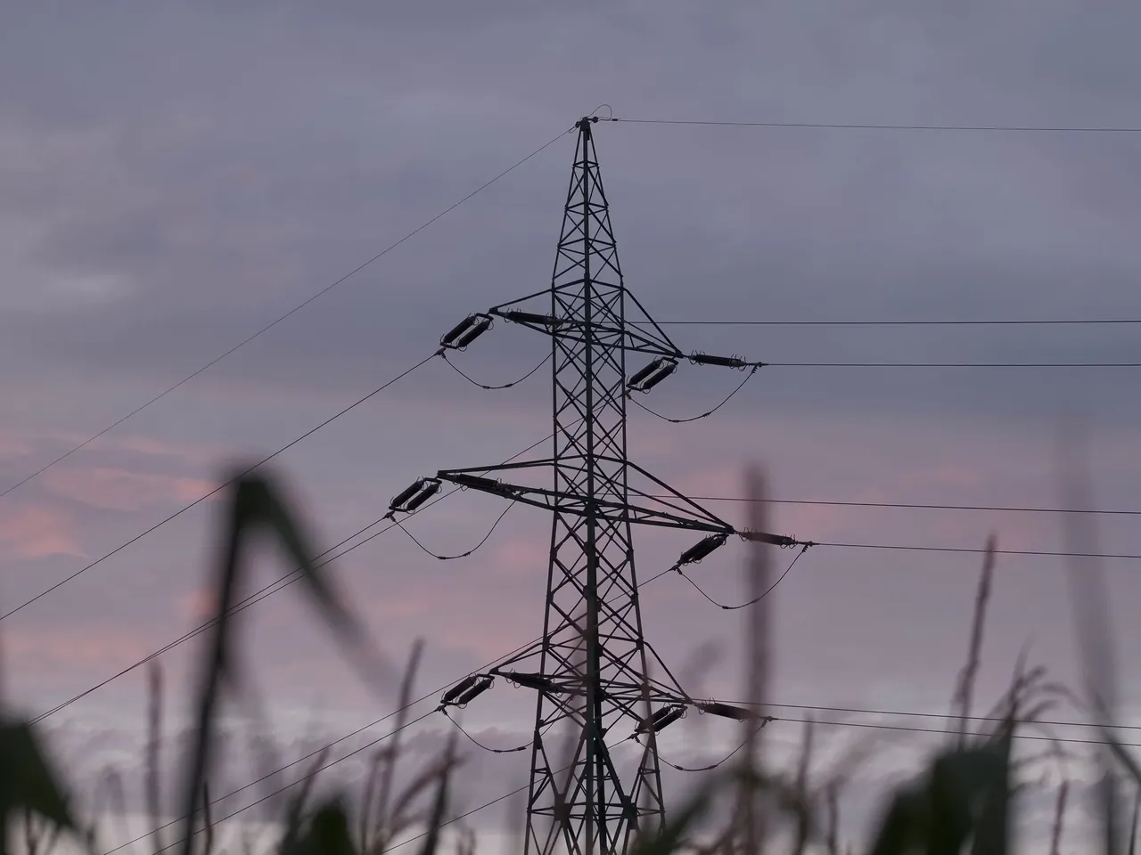 Electricity pylon against an evening sky
