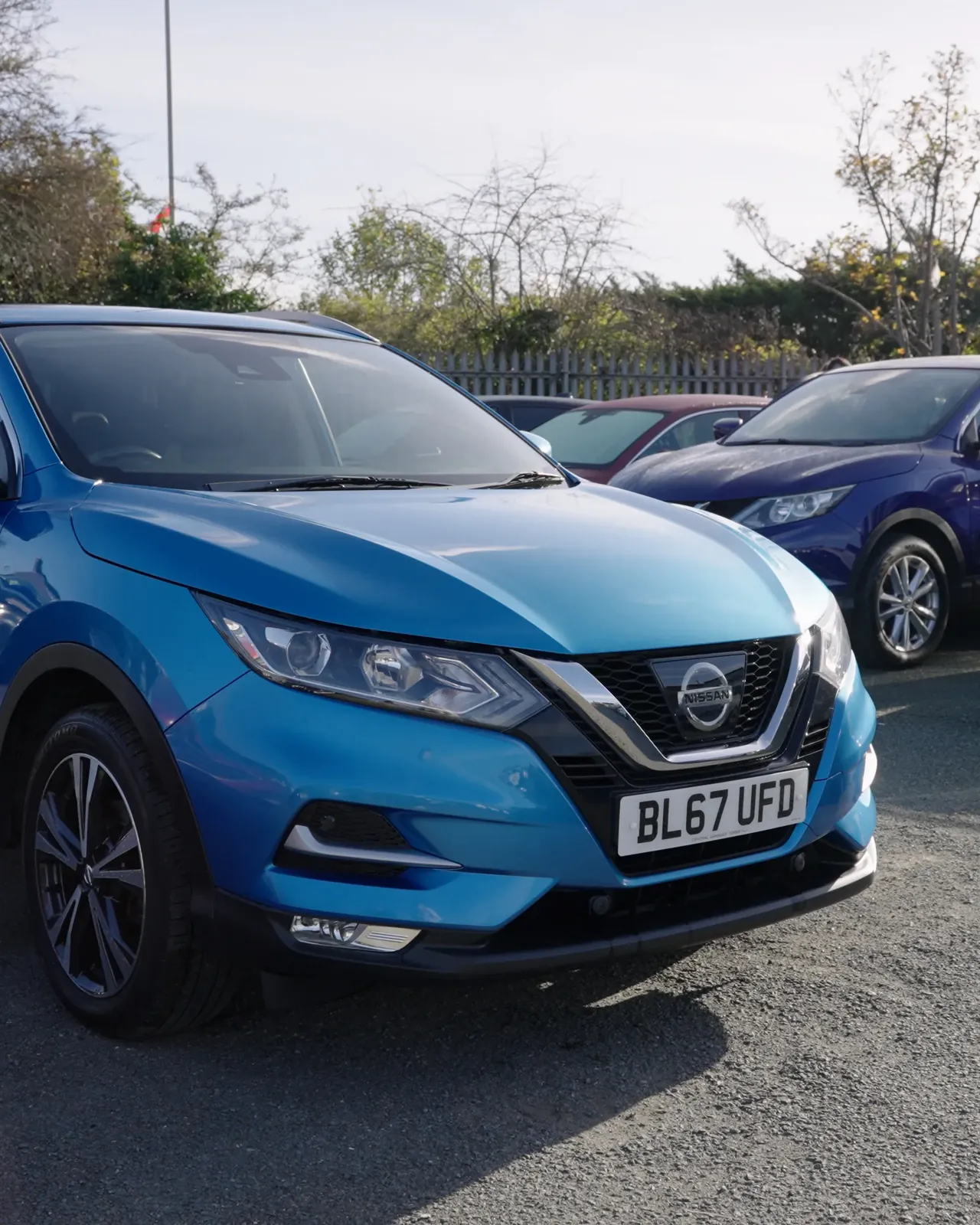 Blue hatchback on the forecourt