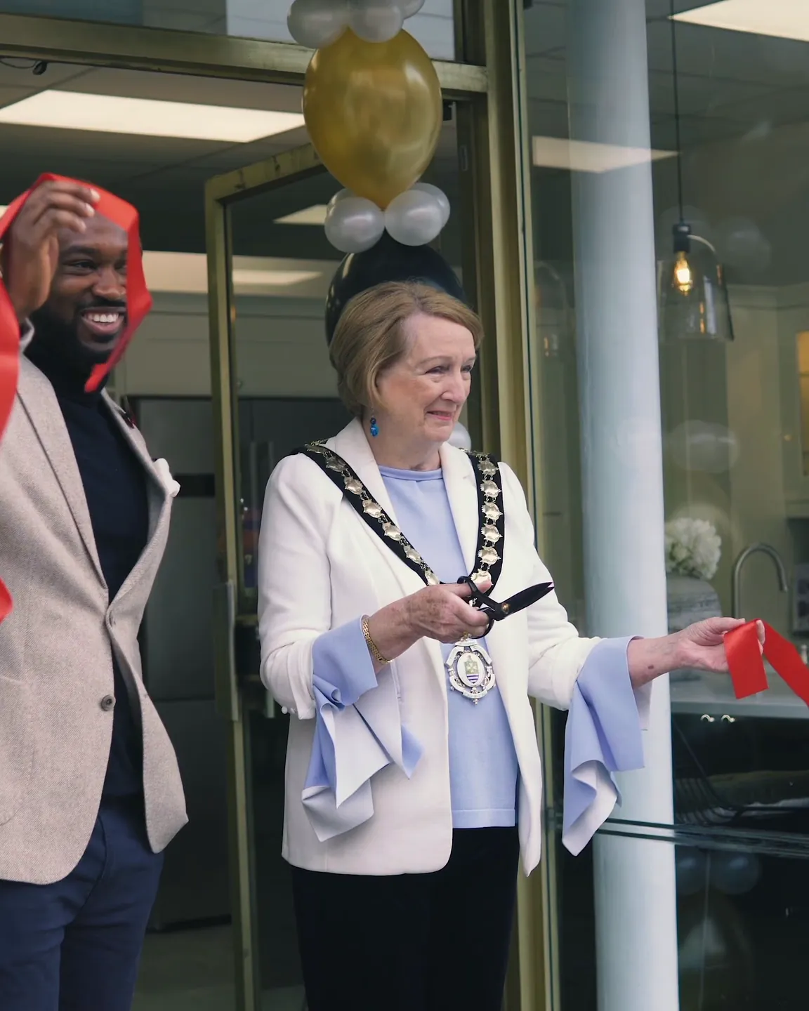 Ribbon cut at the doorway