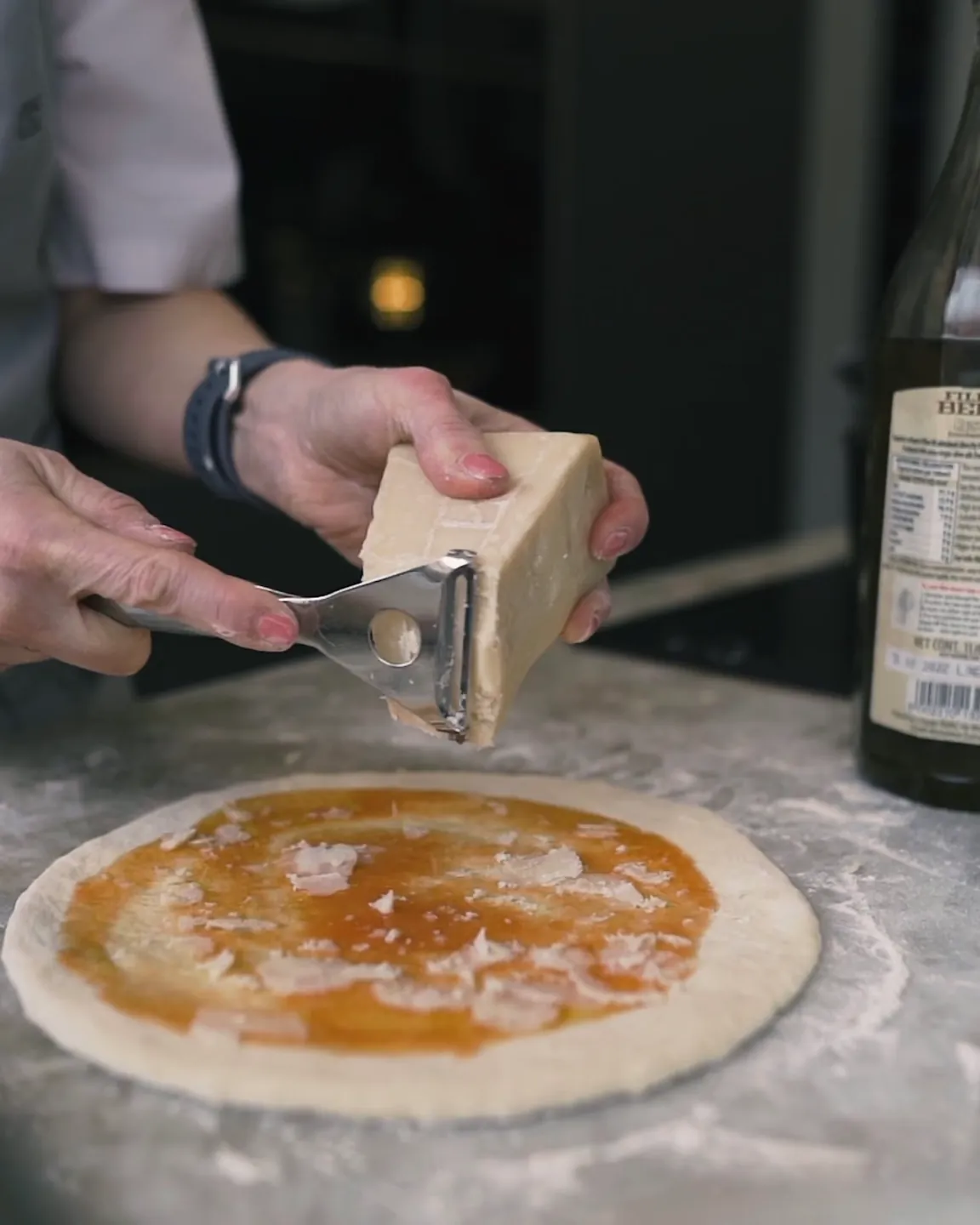 Pizza being prepared on the worktop