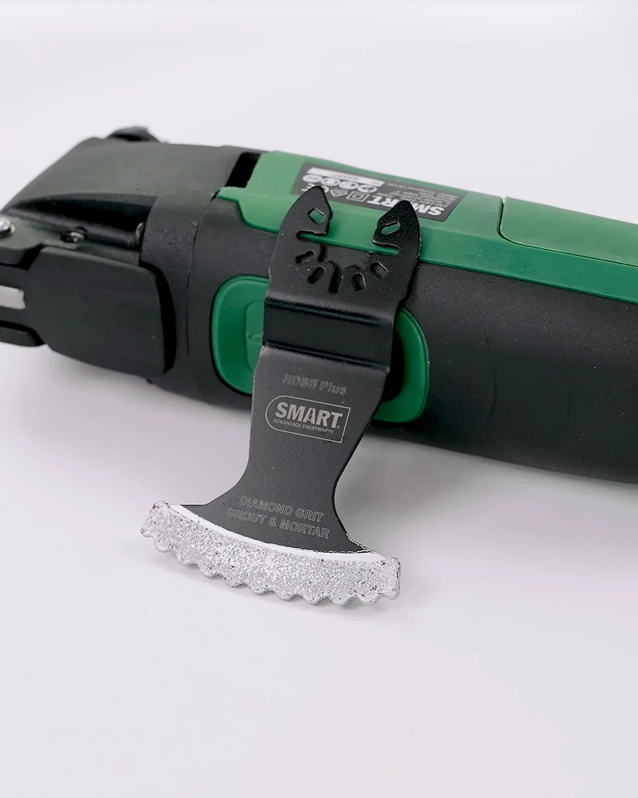 Multi-tool with a blade accessory on a white background