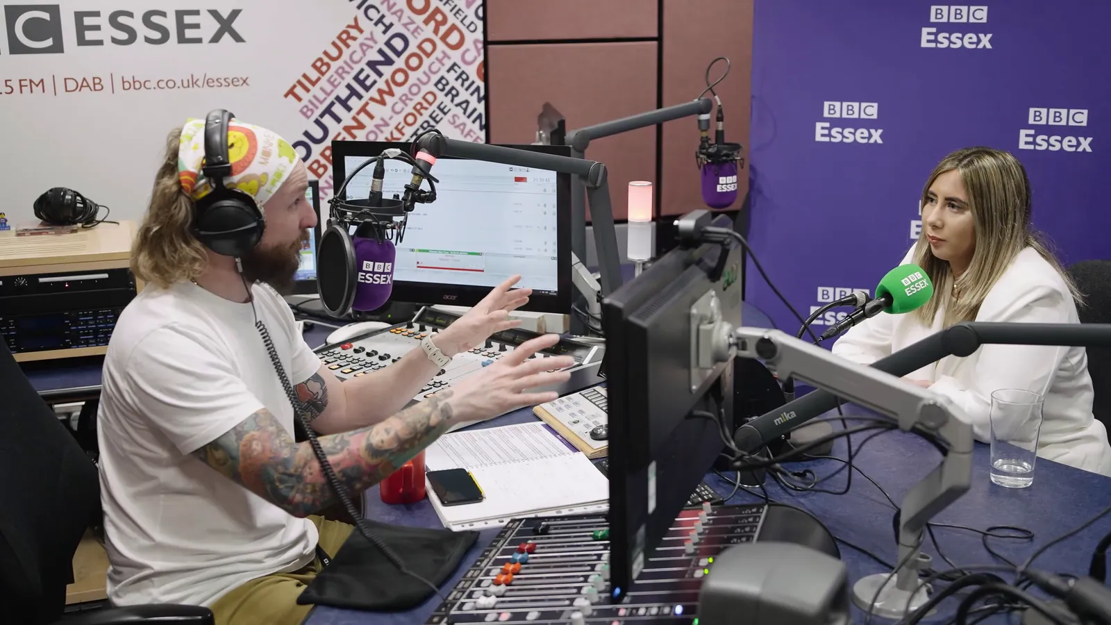 Two people across a studio desk