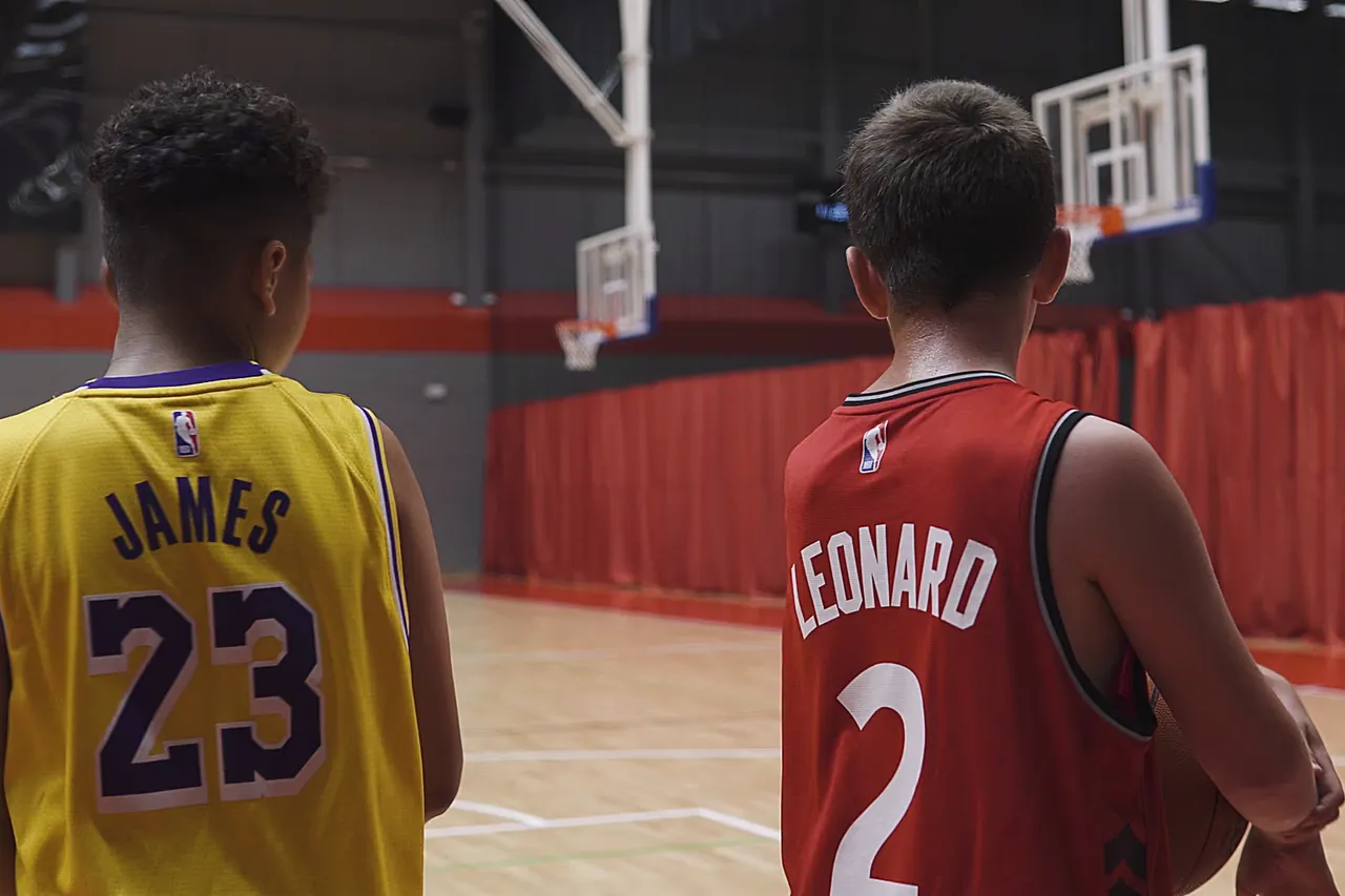 Two basketball players on court