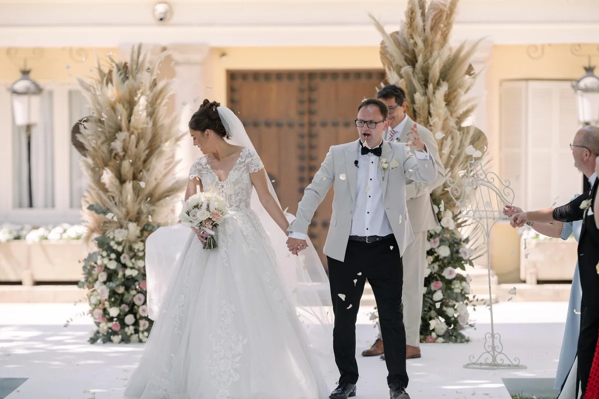 Ellie and Ernie leaving their wedding ceremony