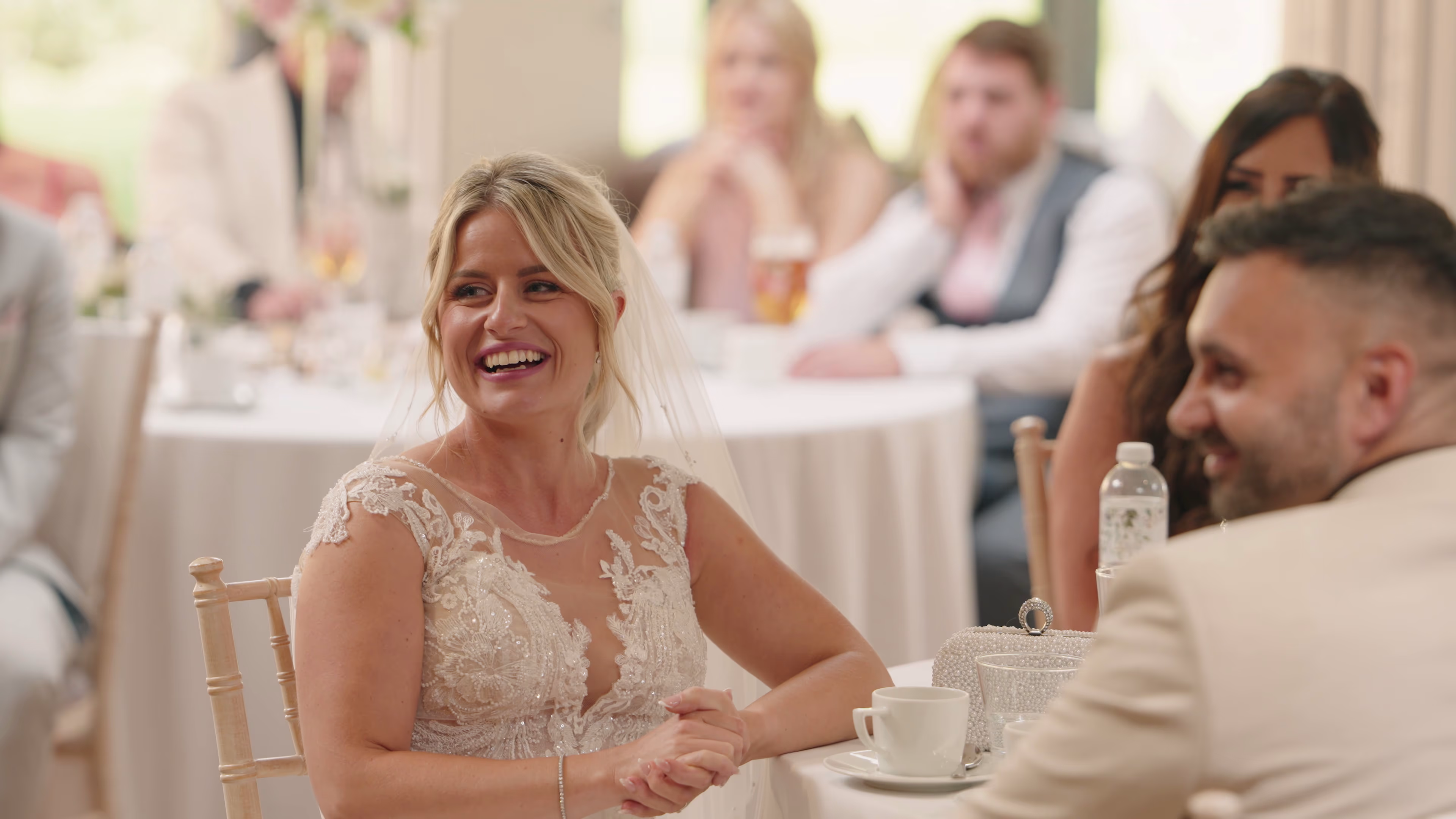 Lisa laughing with Jake during their wedding breakfast