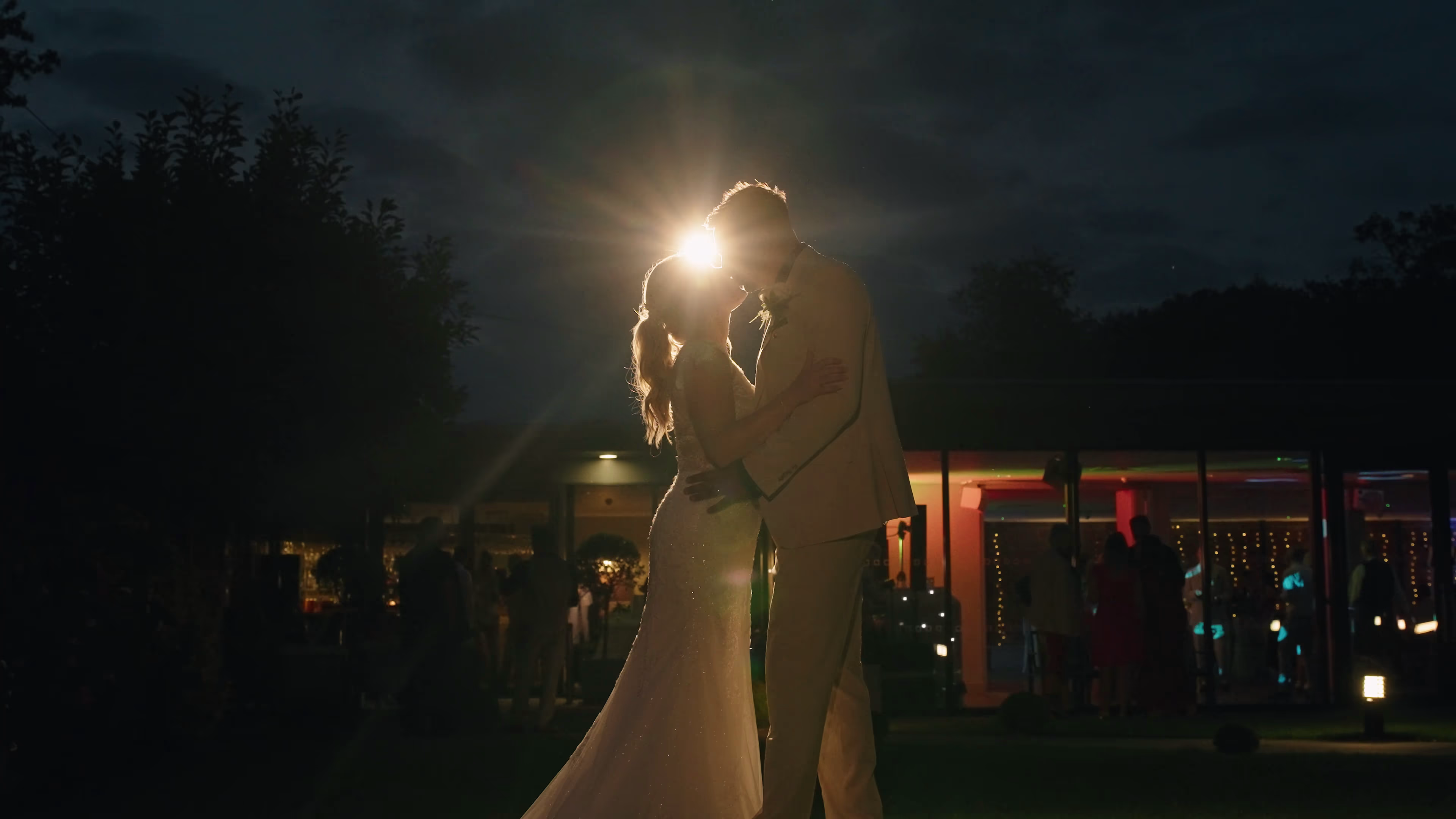 Jake and Lisa silhouetted during evening wedding portraits