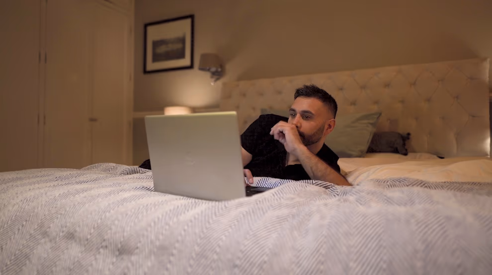 Jake Aldridge looking at online comments during the opening of Rather Be Me