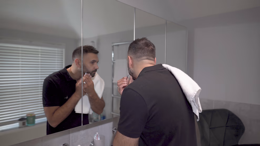 Jake Aldridge and his inner self in the bathroom mirror