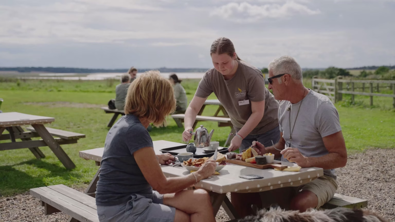 Visitors dining outside Old Hall Café near Southwold
